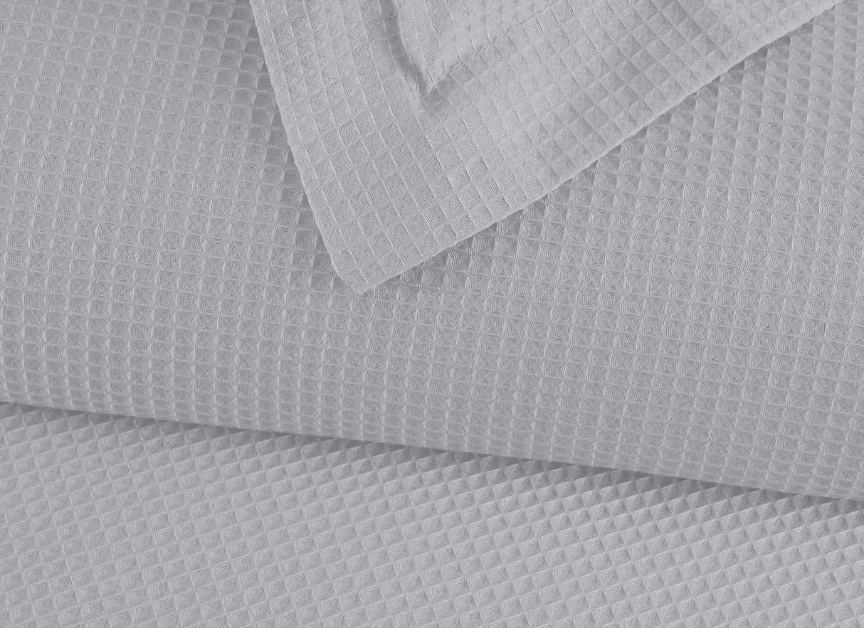 Duvet Elric · confeccionado en 100% algodón • tejido waffle que ofrece una textura única.